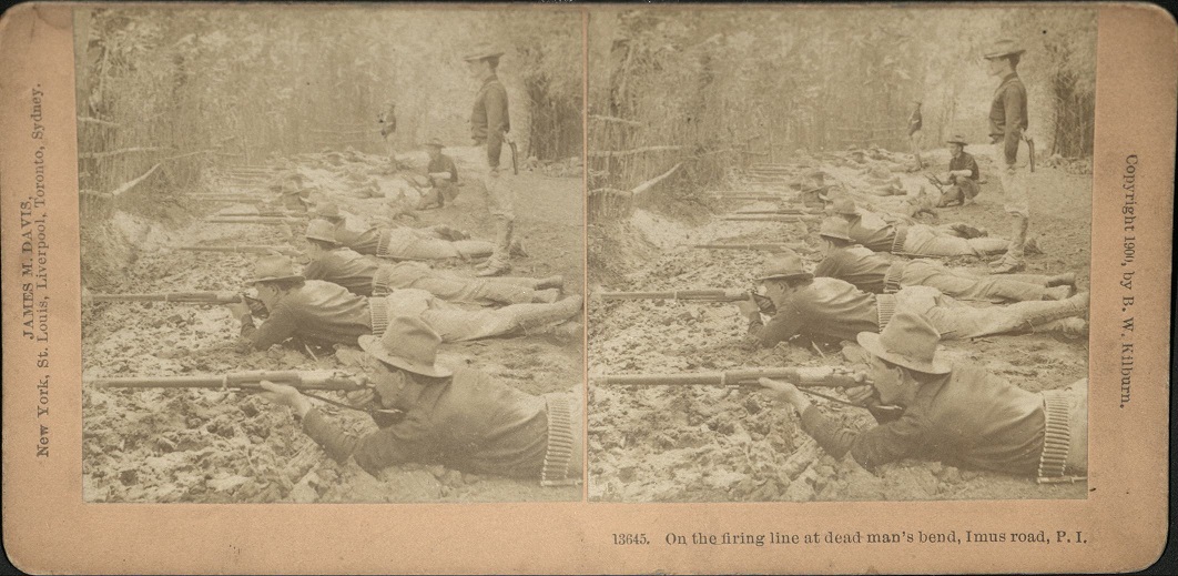 On the firing line at dead man’s bend, Imus Road, P. I.